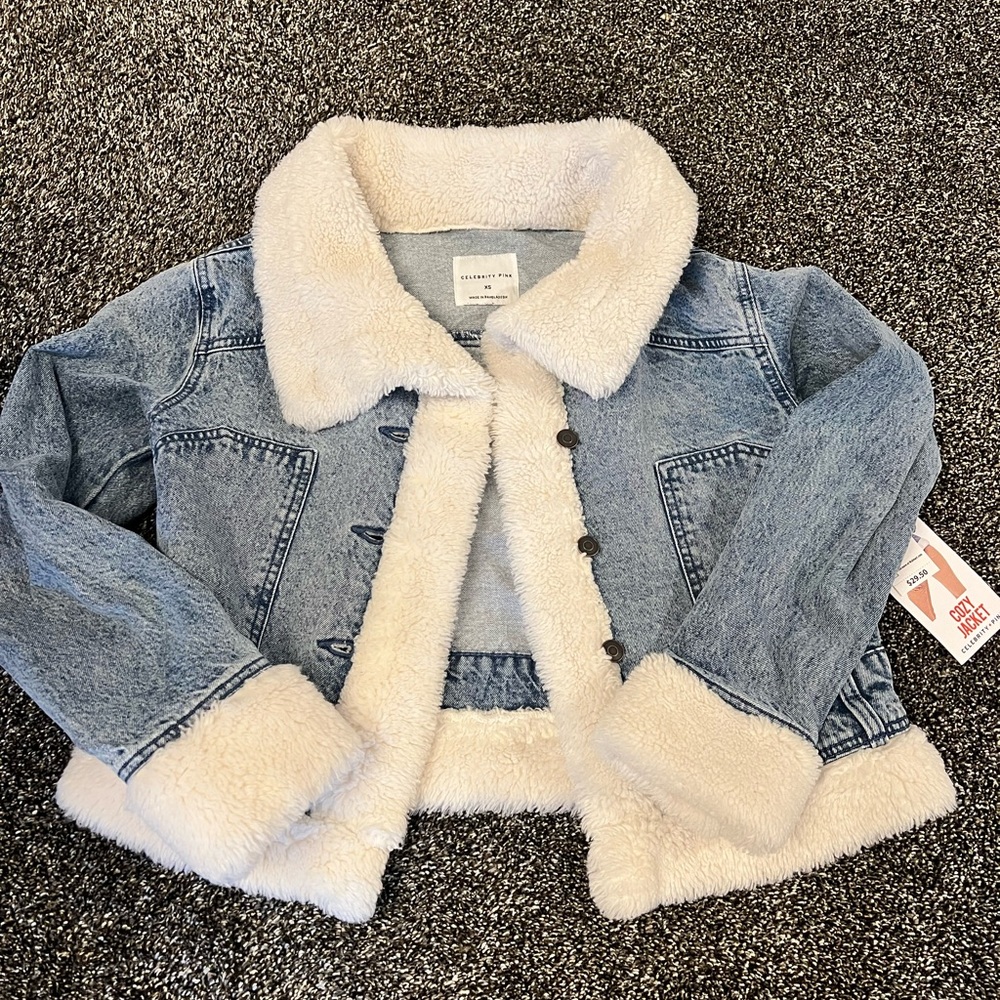 Cute Jean jacket with fur at cuff and bottom of jacket.  Brand new with tags. XS